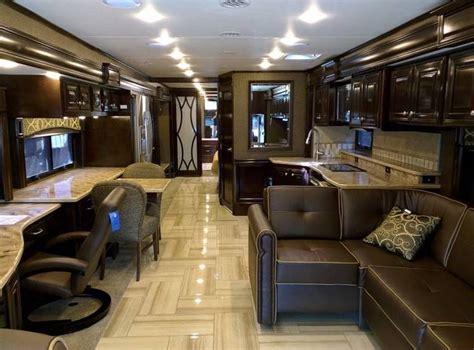 A Living Room And Kitchen Area In A Recreational Vehicle Or Motor Home
