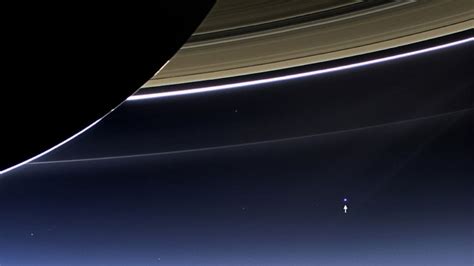 Earth Strikes A Pose Beneath Saturns Rings Abc News