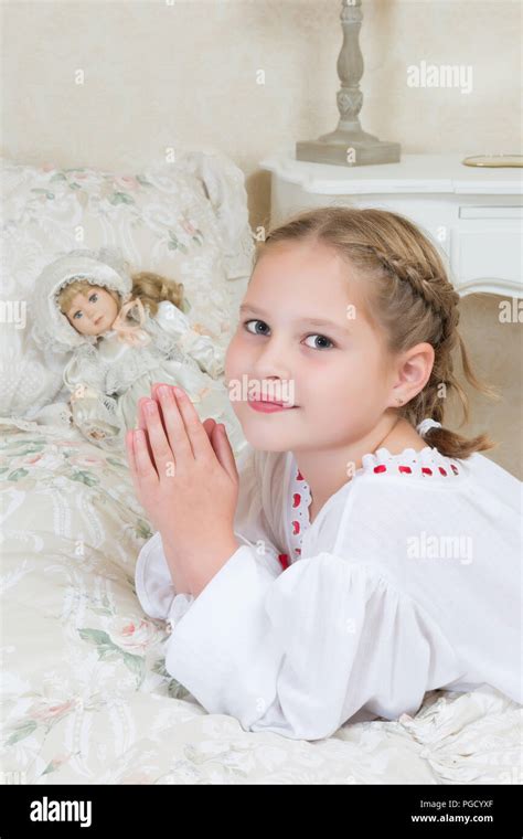 Innocent Little Girl Praying In Her Bedroom Stock Photo Alamy