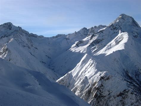 Free Stock Photo Of Rugged Peaks And Steep Valleys Covered In Snow