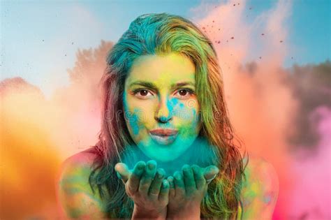 Young Woman Blowing Holi Powder From Hands To Camera Happy Woman