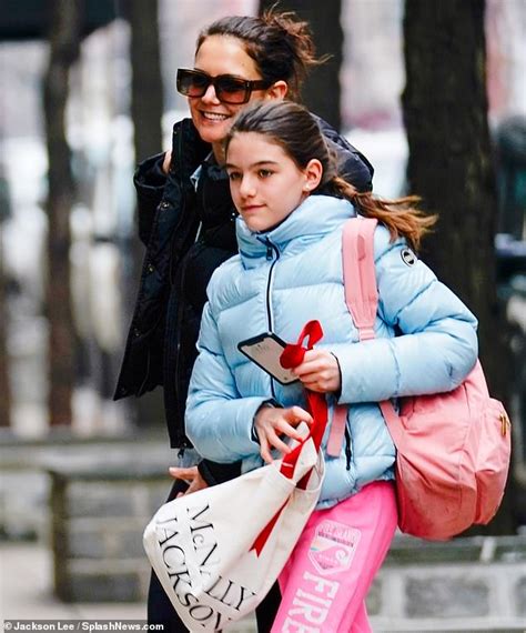 katie holmes and daughter suri cruise bundle up in puffer jackets for mother daughter day in nyc