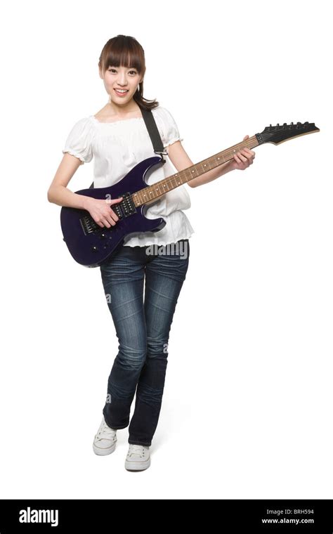 Young Woman Playing An Electric Guitar Stock Photo Alamy