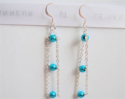 Boucles d oreilles chaine et perles nacrées turquoises Bijoux fait