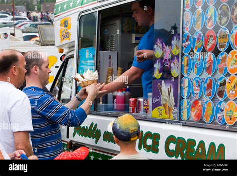 Man Buying Icecream Cornets From Ice Cream Van Stock Photo Alamy