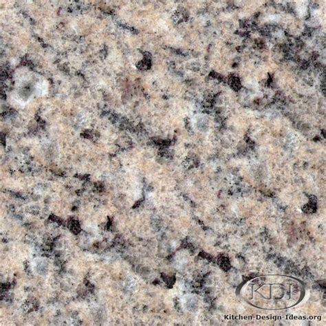 The bianco antico granite with an ogee edge contains light shades of color and sets off the white cabinets perfectly. Giallo Light Granite - Kitchen Countertop Ideas