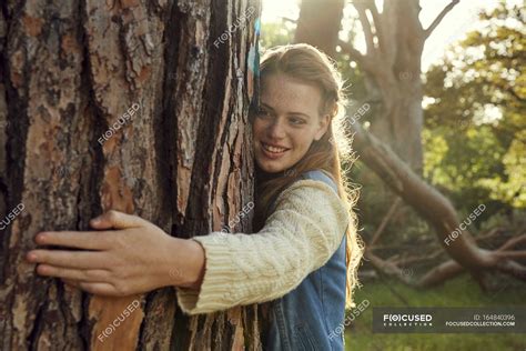 Woman Hugging Tree Tree Trunk Casual Stock Photo