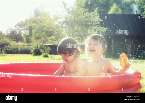 Baby Splashing In The Pool Outdoors Stock Photo Alamy