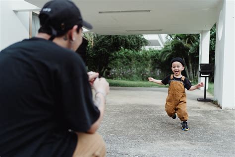 A Father Chasing His Son · Free Stock Photo