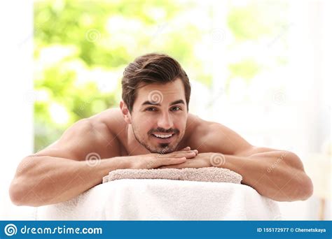 Handsome Young Man Relaxing On Massage Table Stock Image Image Of