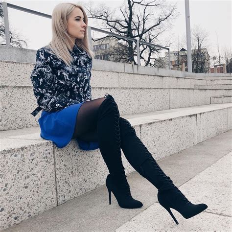 black high heels thigh high boots on black pantyhose with a short blue skirt thighhighboots