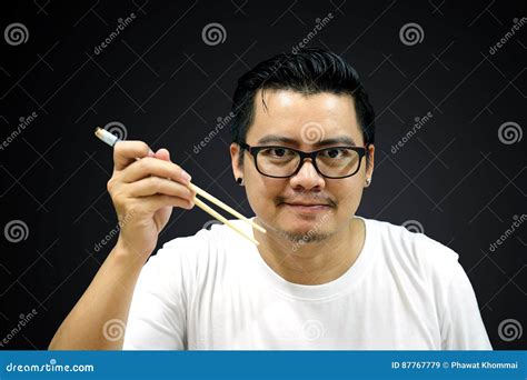 Asian Man Holding Chopsticks Ready To Eat Stock Image Image Of