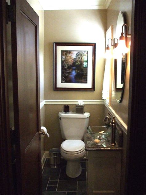 By replacing the sink cabinet with a pedestal sink, we opened up the bathroom visually and practically. Small Powder Room