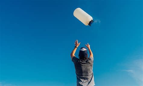 Premium Photo Man Throwing A Plastic Bottles