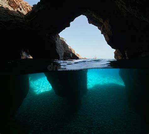 Over Under Water Inside A Cave On The Sea Shore Stock