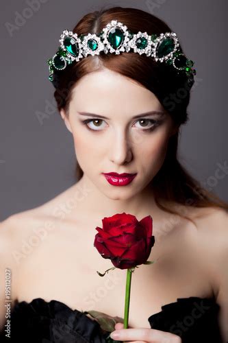 Young Redhead Girl With Tiara And Rose Acquista Questa Foto Stock Ed