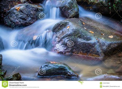 Beautiful Silky Soft River Waterfalls Flowing In Autumn Scenery Forest