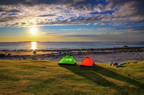 Camping At Sunset With Tents On Uttakleiv Beach In Lofoten Islands