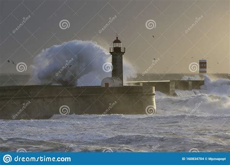 Stormy Waves Over Piers And Lighthouses Stock Photo Image Of Orange