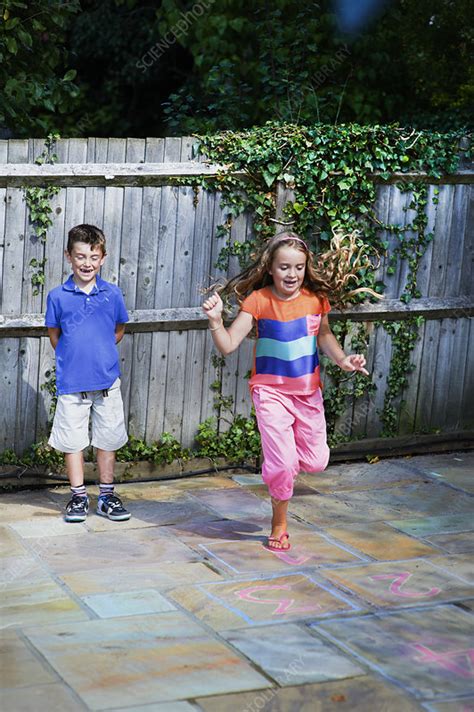 Kids Playing Hopscotch