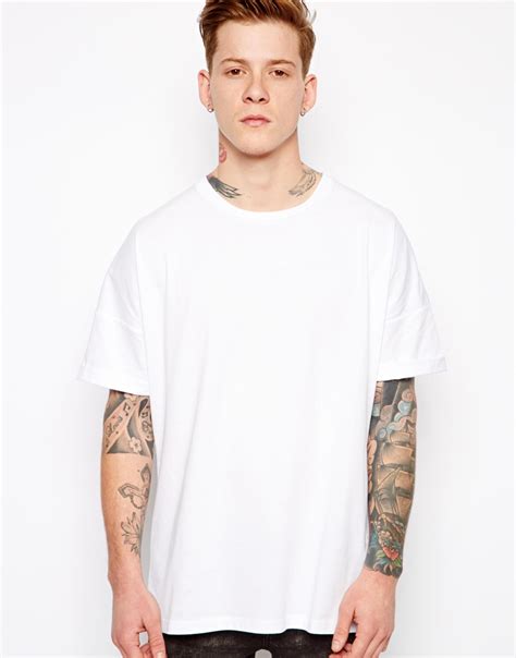 Asos T Shirt With Oversized Fit And Roll Sleeve In White For Men Lyst