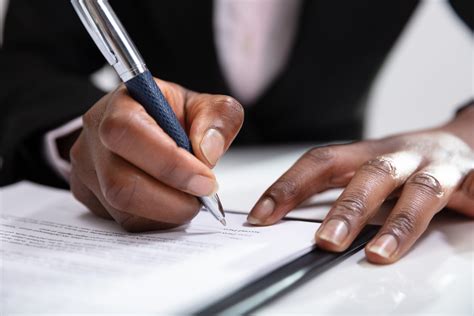 Woman Signing A Contract Spc Business Consulting