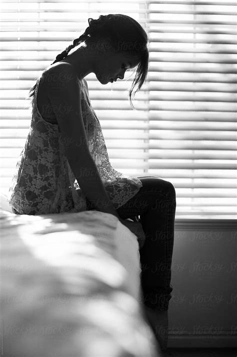 Woman Sitting Next To Window By Stocksy Contributor Ryan Muirhead Stocksy