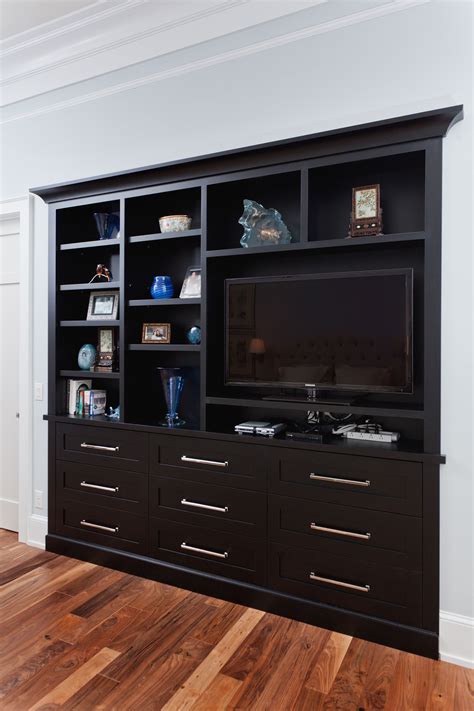 The most trusted masonry contractors in pensacola, fl are on porch. Black built in tv cabinet in living room. Designed by: In ...