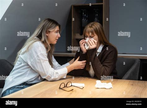 Young Friend Woman Comforting Her Sad Depressed Colleague In Office Who