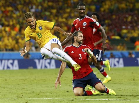 neymar being fouled in the world cup 2014 in brazil vs colombia neymar jr brazil and al