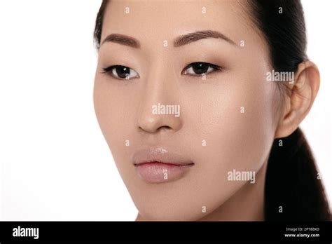 Close Up Portrait Of Beautiful Young Asian Woman On White Background