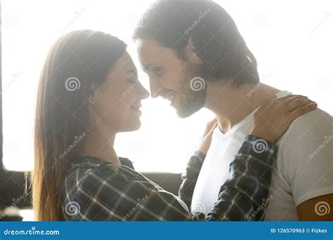Passionate Boyfriend Admiring Girlfriend Hugging In Bedroom Stock Image