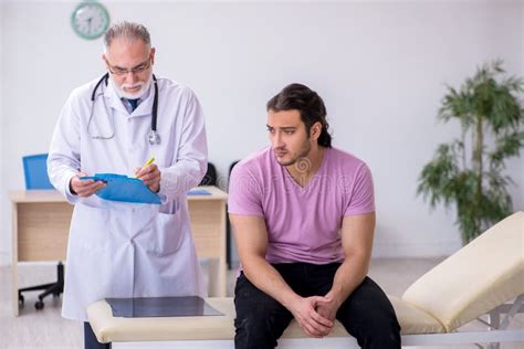 Young Male Patient Visiting Old Male Doctor Stock Image Image Of