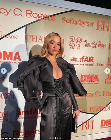 Rita Ora Puts On A Busty Display In Black Ensemble With Plunging