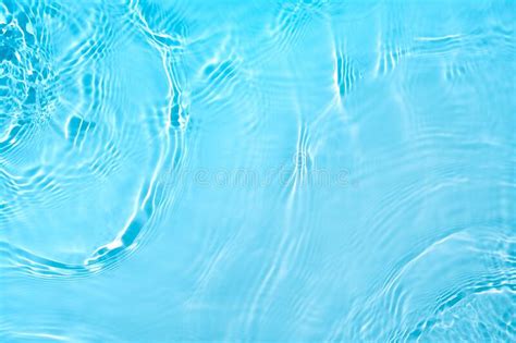Transparent Blue Colored Clear Calm Water Surface Texture Stock Photo