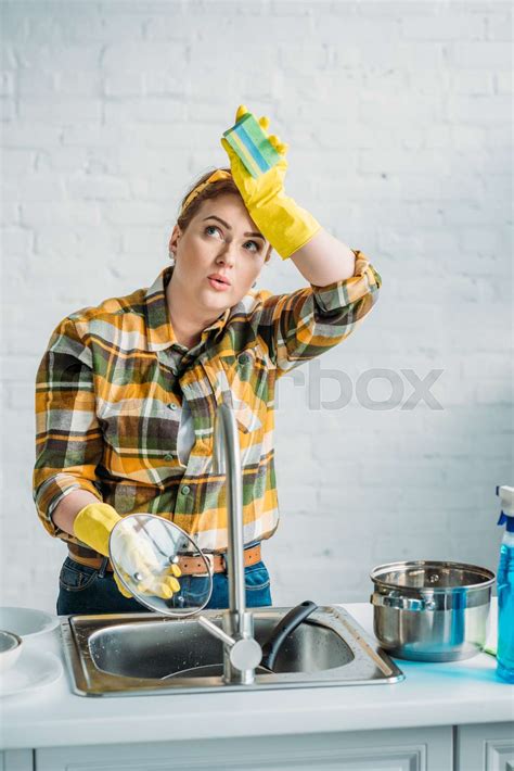 Beautiful Tired Woman Washing Dishes At Kitchen Stock Image Colourbox