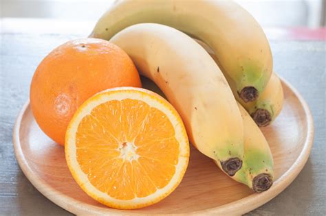 Healthy Fruits With Oranges And Bananas Stock Photo Download Image