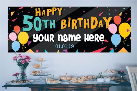 A Birthday Banner With Balloons And Confetti On The Table In Front Of It