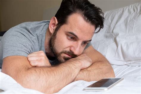 Sad Guy Waiting A Phone Call Lying In Bed Stock Photo Image Of Mobile Jealous