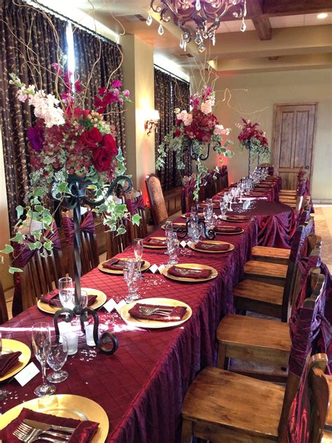 Winter fruits ranging from deep reds to black, tied the look together. Burgundy centerpieces Hydrangea, dahlias, snap dragons ...