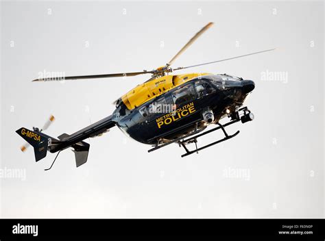 A Metropolitan Police Helicopter Flies Over London To Observe Crowd