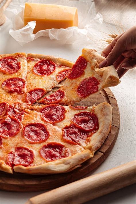 Taking A Slice Of Fresh Baked Pepperoni Pizza Stock Image Image Of