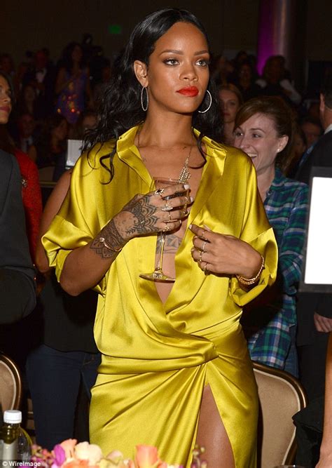 Rihanna Narrowly Avoids Wardrobe Malfunction In Daring Yellow Frock At