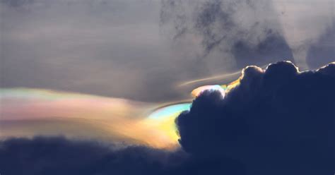 Iridescent Clouds Captured In Rare Sighting On Siberian Peak Mystical