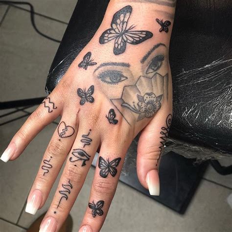 Sisters often like to have small matching tattoos. Butterflies Tattoo | Hand tattoos for women, Simple hand ...