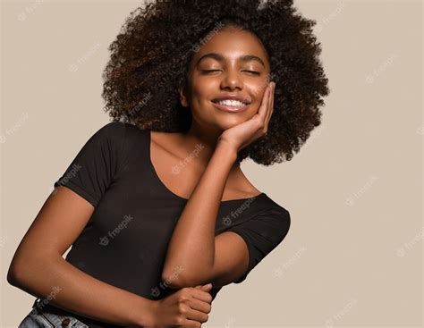 Premium Photo Beautiful African Woman Black T Shirt Portrait Afro Haircut Touching Her Face
