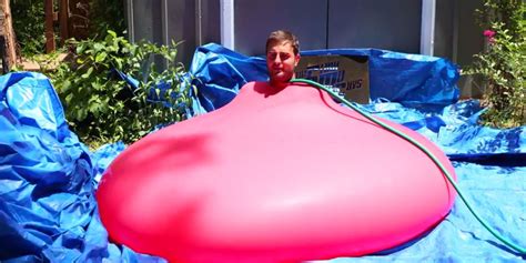 The Slow Mo Guys Capture A Giant Water Balloon Popping With A 6ft Man