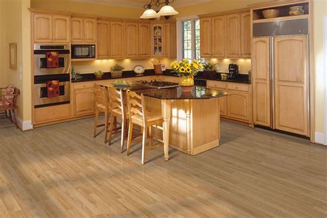 Oak is a hardwood and, if properly cared for, can still be used in contemporary kitchens.however, the typical orange oak finish of decades past can look dated in today's kitchens. Light wheat oak strip #laminate wood floors for kitchen. | Laminate flooring in kitchen, Maple ...