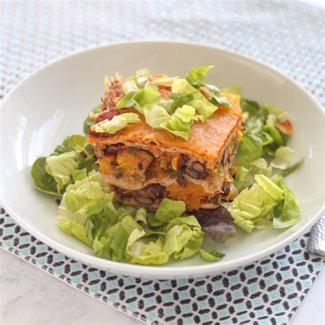 Chicken, sour cream, tortilla cubes, sauce, and cheese. Layered Enchilada Casserole