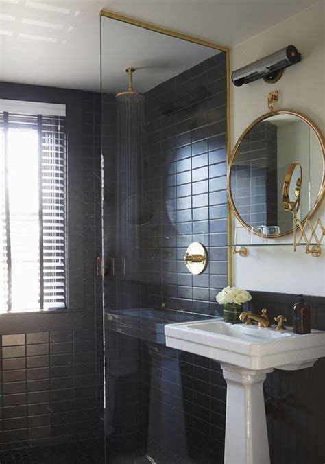 Another stunning shower featuring dark charcoal zellige tile set off by metallic grout. 36 black shower tile ideas and pictures